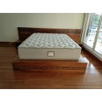 Fijian motif curving King size bed, Raintree, stained, integrated bedsidetables.